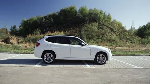 White BMW X1 in the parking lot. Side view Stock Footage 252147688