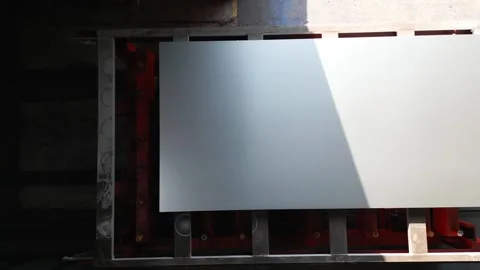 A white board with a red frame is sitting on a table Stock Footage 302456245