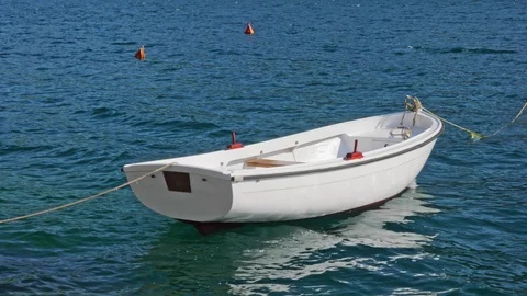 White boat on blue waves Stock Footage 90222499