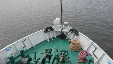 White boat bow with green deck brown pink coloured ropes Stock Footage 155286349