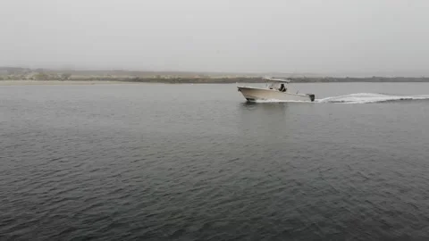 White Boat Creating Waves in the Water on Foggy Day, Aerial View Stock Footage 142320221