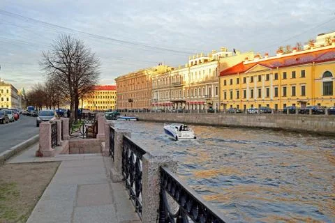 White boat floating on the river Moika in St. Petersburg Stock Photos