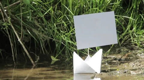 White boat floating on the shore of the small stream 272 Stock Footage 58287611