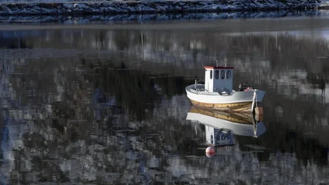 White boat moored on a lake Stock Footage 113227244