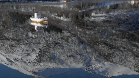 White boat moored on a lake Stock Footage 113227309