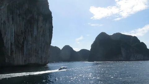 White boat sails to the beautiful Phi Phi Island Lagoon, Phuket, Thailand Stock Footage 114371765
