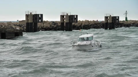 A white boat sails at high speed along the bay in the afternoon. Motorboat. Blue Stock Footage 241525524