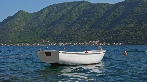 White boat swinging on blue waves Stock Footage 90220175
