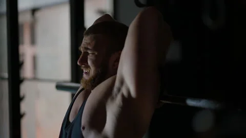 White bodybuilder doing extending the arms from behind the head while standing Stock Footage 102512161