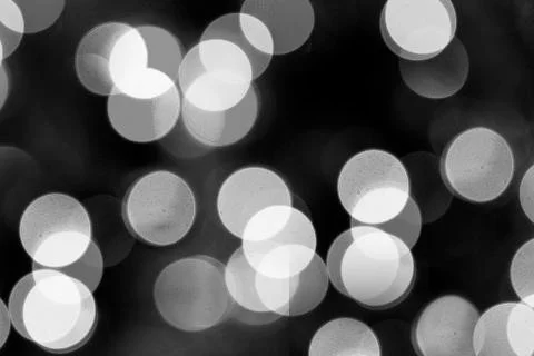 White bokeh on a black background Fotos de archivo