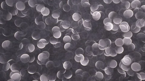 White bokeh circles changing size on a dark abstract background for elegant.. 스톡 동영상 341736875