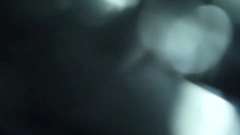 White bokeh floating in the air on a black background Stock Footage 315320055