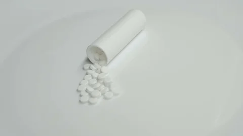 White Bottle and pills rotating on white background Stock Footage 83692205