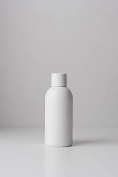 White bottle on a light background, representing beauty, wellness, or skincar Stock Photos