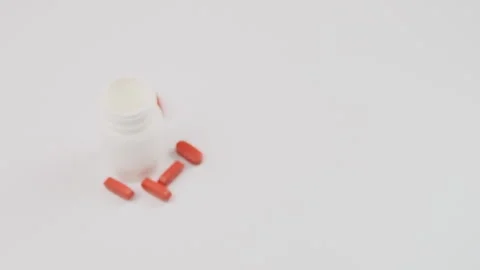 White bottle with pills on a white background health concept. Blurred Stock Footage 279874000