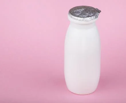 White bottle on pink background Foto stock