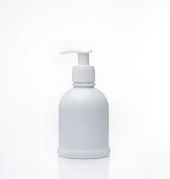 White bottle with reflection isolated on white background. Stock Photos