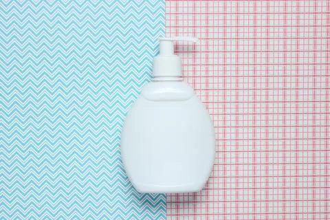 White bottle of shampoo on creative background, top view. Фото