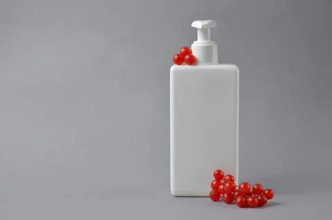 White bottle for soap on a gray background. Stock Photos