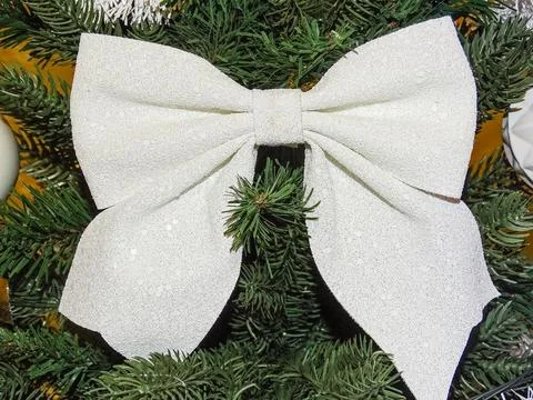 White bow on a Christmas tree Photos