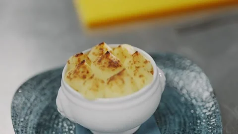 A white bowl filled with mashed potatoes and gravy Stock Footage 295994981