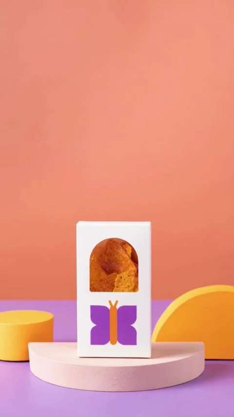 White box with butterfly logo containing orange corn chips Stock Footage 331770603