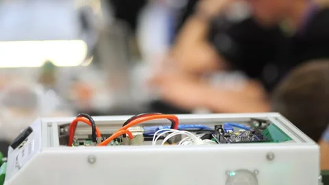 White box with exposed electronics and colorful wires Stock Footage 345680792