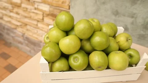 White box with green apples for decor Stock Footage 137629676