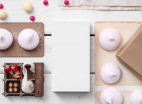 White box mockup between sweets on the table Stock Photos