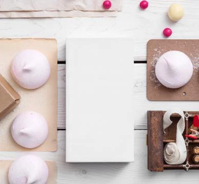 White box mockup between sweets on the table Stock Photos