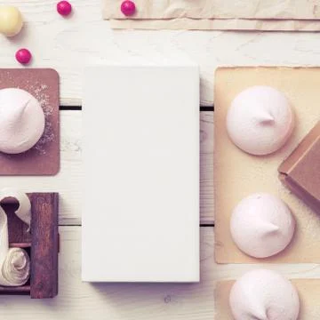White box mockup between sweets on the table 写真素材