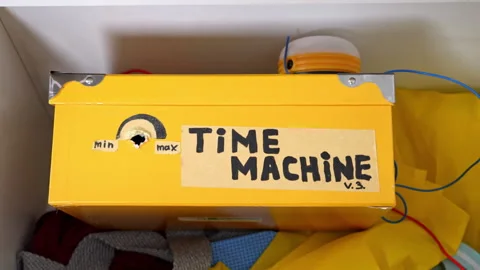 A white box that opens with a hand and is partially filled with an object, a Stock Footage 326969652