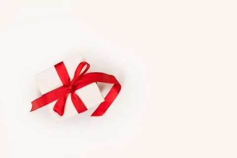 White box with red bow on a white background with copy space 스톡 사진