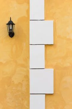 White boxes in the background of an orange wall Stock Photos