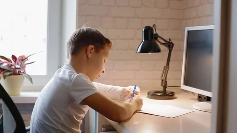 White boy doing his hometask Stock Footage 84137158