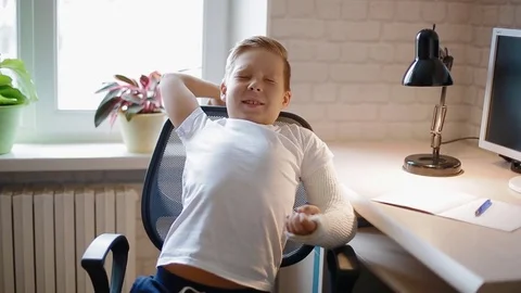 White boy stretching after doing his hometask Stock Footage 82861086