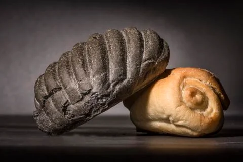 White bread and bread with charcoal Stock Photos