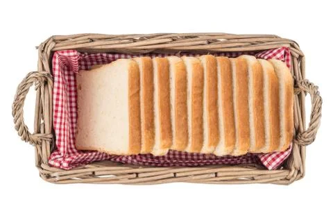 White bread in basket. Slice. Isolated on white background. Stock Photos