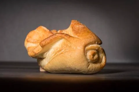 White bread on a black background Stock Photos