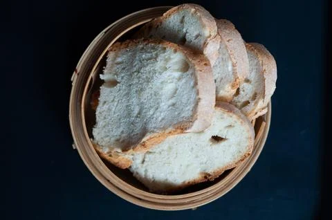 White bread on black background Stock Photos