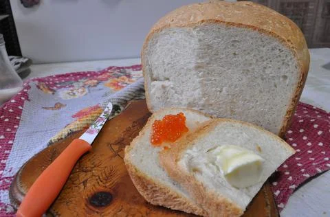 White bread on a board with red caviar Stock-Fotos