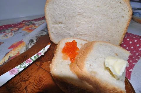 White bread on a board with red caviar Stock Photos