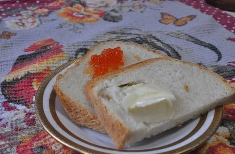 White bread on a board with red caviar Stock Photos