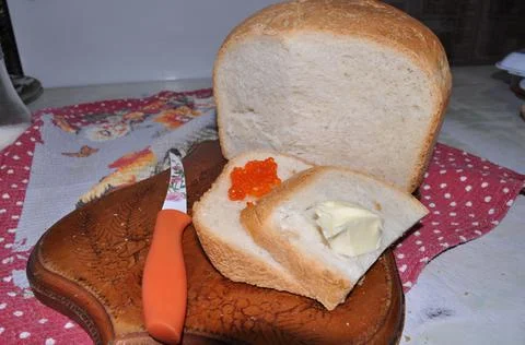 White bread on a board with red caviar Stock Photos