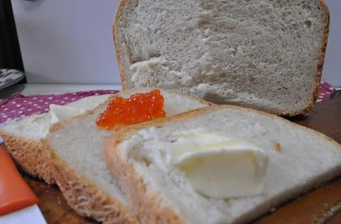 White bread on a board with red caviar Stock Photos