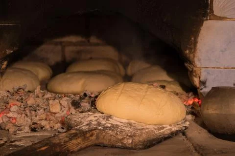 White bread is cooked in an old oven Stock Photos
