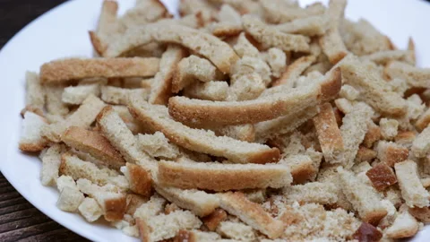 White Bread Crackers. Bread Crispy Crackers From White Bread On A White Flat Pla Video stock 235143489