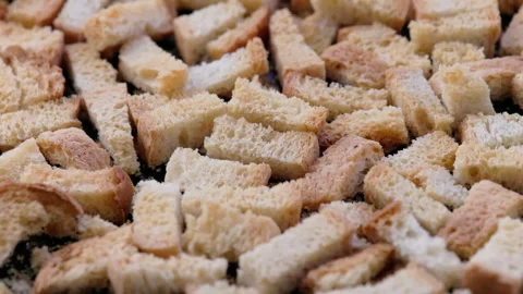 White bread croutons on flat surface, full-frame closeup view Stock Footage 258772102