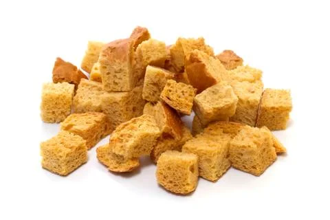 White bread croutons on a white background Stock Photos