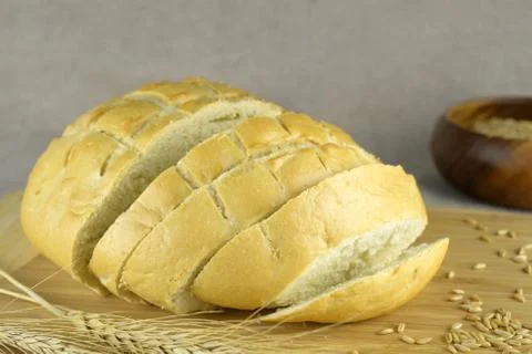 White bread cut on a blurry background Stock Photos